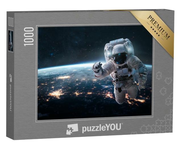 Puzzle de 1000 pièces « Un astronaute plane au-dessus de la Terre la nuit »