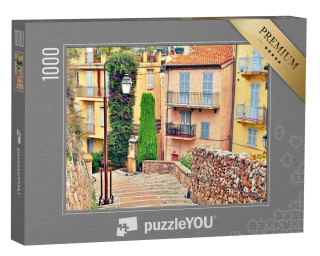 Puzzle de 1000 pièces « Rue avec immeubles et trottoir pavé à Cannes, France »