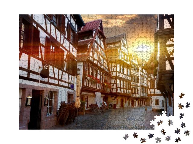 Puzzle de 1000 pièces « Rue avec maisons à colombages historiques dans le quartier de la Petite France à Strasbourg, France »